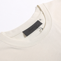 Essentials Short Set Crema Logo