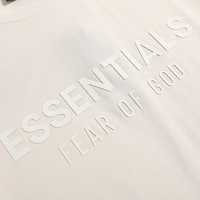 Essentials Short Set Crema Logo