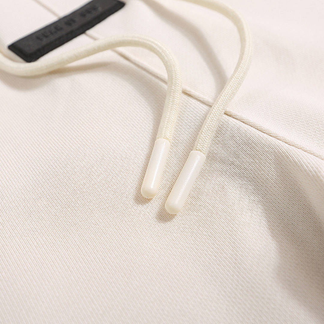 Essentials Short Set Crema Logo
